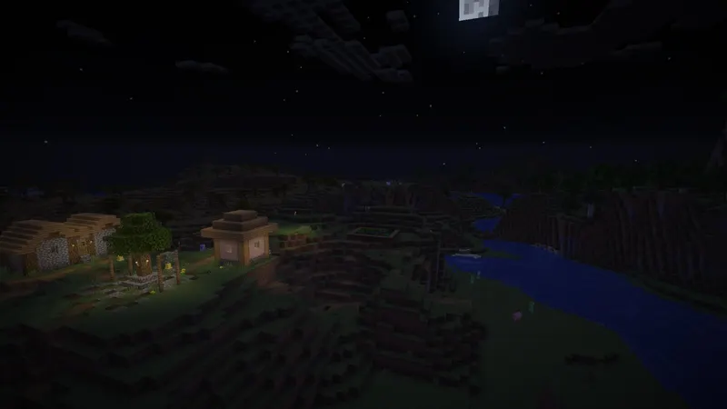Moonrise over a torch-lit village and river